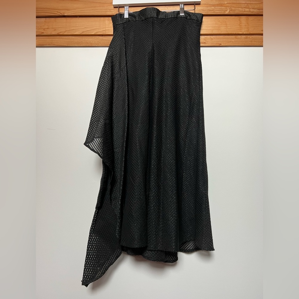 Hiraeth black skirt with zip close. A bit of a mesh overlay and lined No stretch